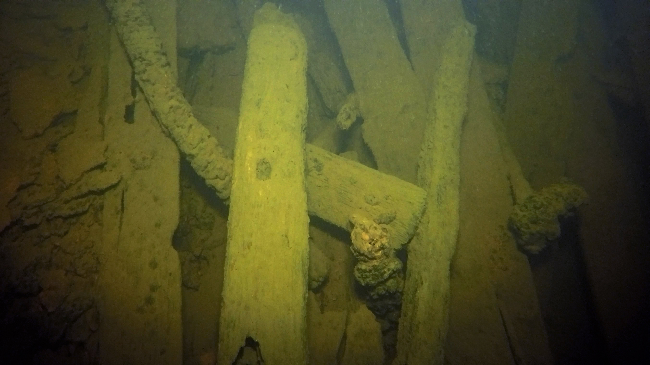 Wooden remains of a barge found in Death Bay off Kilpola Island. Photo by Stanislav Trofimov.